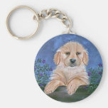 Chaveiro do filhote de cachorro e das flores
