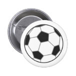Crachá ascendente próximo do botão do futebol boton