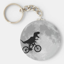 Dinossauro em uma bicicleta no céu com lua chaveiros