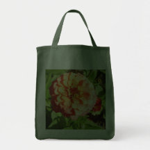 Flor alaranjada do Zinnia no bolsa do mantimento