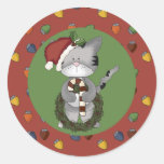 Gato do papai noel com bastão e grinalda de doces adesivo