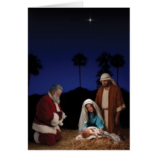 Papai noel que ajoelha-se na natividade cartão