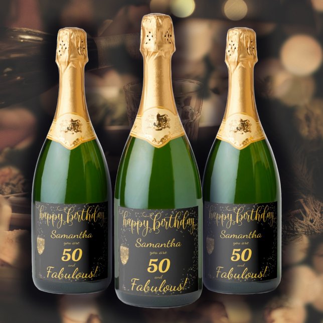 50 e Fabuloso Aniversário Negro e Dourado (50 and Fabulous Birthday Template design in black and gold, a glass of champagne and sparkles... )