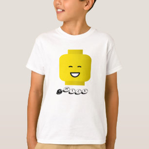 A cabeça amarela do sorriso caçoa o t-shirt