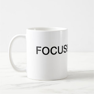A caneca de café do foco