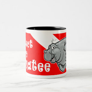 A caneca de café do mergulhador do peixe-boi