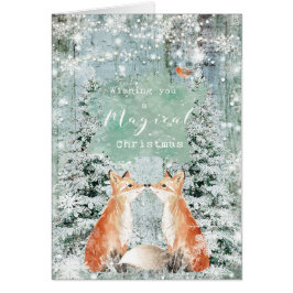 A neve do inverno do Feliz Natal foxes o cartão