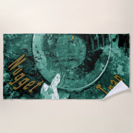 A toalha de praia da armadilha do ouro