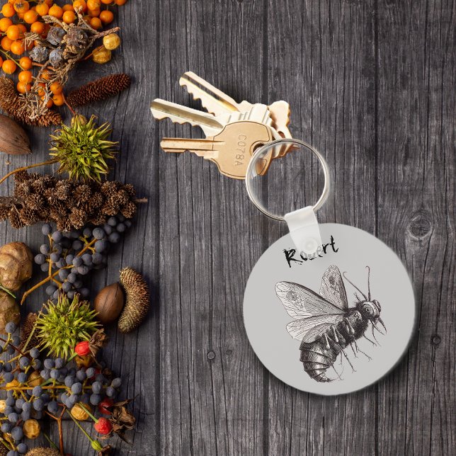 Abelha Personalizada Com Chaveiro De Asas Crânio (Big scary bee with skull crossbones on wings on grey keychain.)