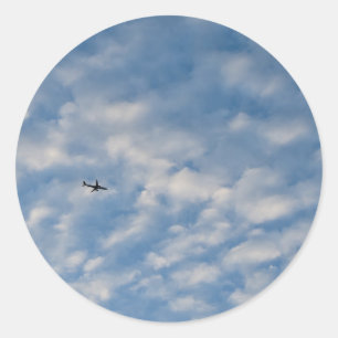 Adesivo Airplane Crossing a Cloud-Filled Blue Sky