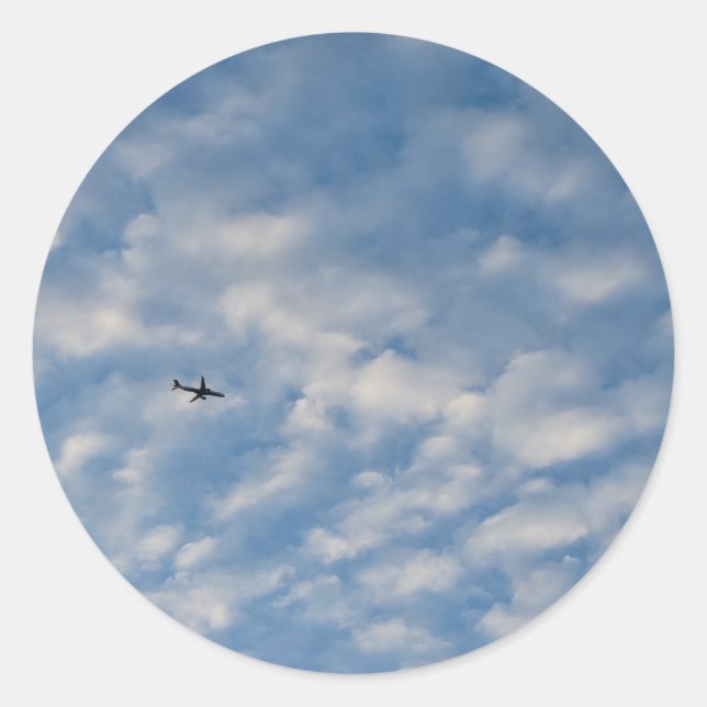 Adesivo Airplane Crossing a Cloud-Filled Blue Sky (Frente)