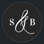 Adesivo Black Whimsical Calligraphy Wedding Monogram<br><div class="desc">Add a charming finishing touch to your wedding stationery or favors with this wedding sticker featuring a whimsical calligraphy ampersand. Designed with a romantic yet modern flair, this sticker is perfect for sealing envelopes, decorating favor boxes, or adding a personalized detail to welcome bags and more. The hand-drawn ampersand adds...</div>