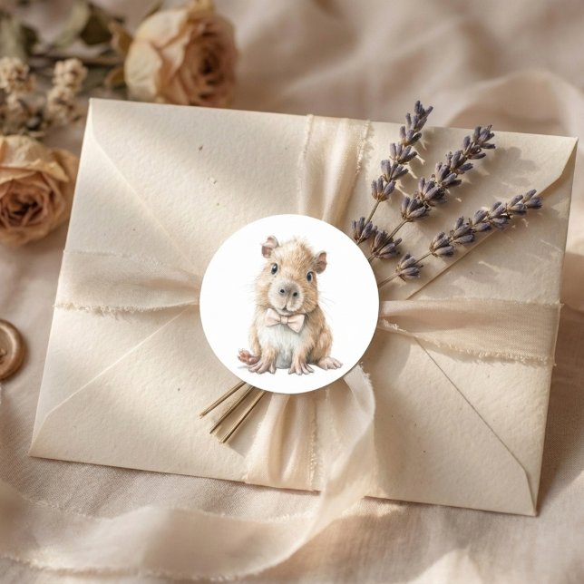 Adesivo Capybara Baby Shower  (soft neutral sticker with baby capybara bow tie on beige envelope with lavender accents)