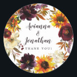 Adesivo Casamento Floral Rustic Autumn Obrigado A Favor<br><div class="desc">As flores de queda dramáticas incluem girassóis amarelos, púrpura, rosas vermelhas escuras e híbridos brancos de marfim. Estão aninhados em folhas do outono e vinhas para criar uma coroa muito bonito. Os nomes dos casais de casamento estão escritos em uma grande fonte de script. Graças a você o sentimento segue...</div>