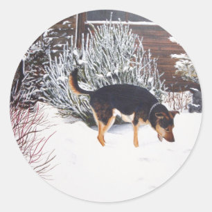 Adesivo Cena da neve do inverno com o cão preto e tan