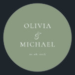 Adesivo Chic Script Sage Green Minimalist Wedding<br><div class="desc">Add a personal and elegant touch to your wedding favors, envelopes, or packaging with this minimalist round sticker featuring your custom name in a graceful script font. Designed to complement a modern and timeless wedding theme, this classic Sage Green and white design pairs beautifully with any part of your celebration....</div>