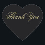 Adesivo Coração Elegante preto e Dourado Monograma Obrigado<br><div class="desc">Esse obrigado elegante em forma de coração que você coloca em dourado em preto será o toque perfeito para suas cartas de agradecimento. Parte da nossa legante suíte de convite de casamento Black & Dourado Heart Flourish projetada pela artista Susan Coffey.</div>