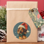 Adesivo Dachshund Christmas<br><div class="desc">Compartilhe a alegria de férias com um charmoso cartão de Natal com um adorável Dachshund fazendo um chapéu festivo de Papai Noel. A expressão alegre do filhote e o toque caprichoso do chapéu trazem calor e alegria ao cartão. Perfeito para espalhar sorrisos e cumprimentos sazonais, este cartão captura o espírito...</div>