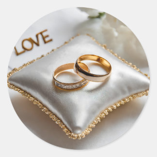 Adesivo Dois anéis de casamento num travesseiro branco