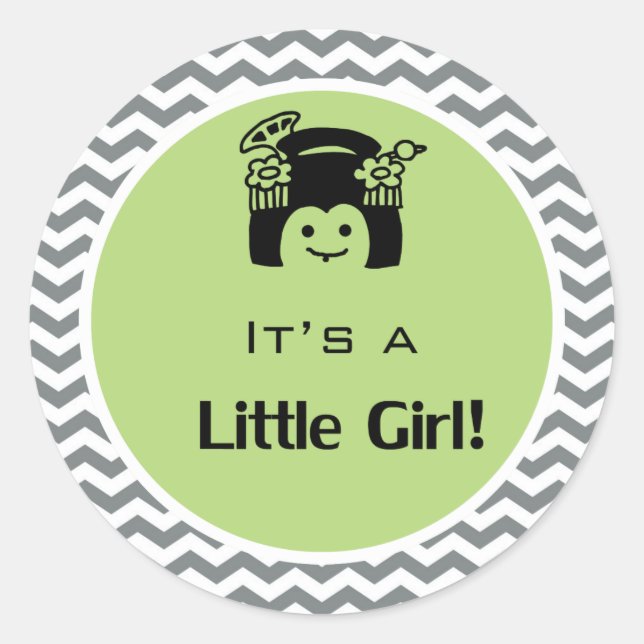 Adesivo É uma menina verde, cinza com adesivos. (Frente)