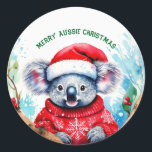 Adesivo Feliz Aussie Christmas Koala<br><div class="desc">Um Natal Aussie muito Feliz com este coala fofo Este coala peludo é um nativo da Austrália que eles são facilmente reconhecíveis pelo seu corpo escondido e cabeça grande com orelhas redondas,  lisas e nariz grande e em forma de colher.</div>