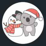 Adesivo Koala With Snowman In Winter For Christmas Classic<br><div class="desc">Koala with snowman in winter for Christmas - a snowman for winter and Christmas. A winter greeting in the cold season for the holidays. Christmas koala with snowman.</div>
