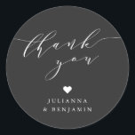 Adesivo Minimalist Elegant Heart Custom Black Thank You<br><div class="desc">This bridal shower favor sticker features flowing script lettering on a classic black background for a modern, understated look. The round design adds a soft, elegant finishing touch to favors, gift bags, boxes, or candles. Simple yet refined, it pairs beautifully with monochrome, minimalist, or contemporary bridal shower décor. A timeless...</div>