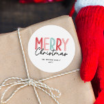 Adesivo Modern Bold Colorful Felry Christmas Family Name<br><div class="desc">O design de etiqueta de Natal contém uma inscrição colorida e ousada que diz "Feliz Natal" numa mistura de tons vermelhos, cor-de-rosa e verdes, acrescentando uma vibração alegre e festiva. A palavra "Feliz" está em letras maiúsculas, com uma combinação divertida de cores, enquanto "Natal" é escrito em um roteiro casual...</div>