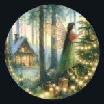 Adesivo Natal do Cottage Core Whimsic<br><div class="desc">Ilustração de arte química de uma fada ou anjo decorando uma árvore de Natal com luzes brancas iluminadas com uma linda casota acolhedora no fundo.</div>