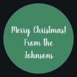 Adesivo Nome da família Green Merry Christmas Gift Label<br><div class="desc">Mantenha-o simples com este design de etiqueta de presente personalizada, verde e branco festivo. Ele tem a mensagem "Feliz Natal" em Tipografia branca / texto e espaço para você adicionar seu próprio nome de família. Basta digitar seu nome no espaço na caixa personalizar este texto. Ou você pode alterá-lo adicionando...</div>