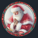 Adesivo Papais noeis católicos de Natal com Rosary Poinset<br><div class="desc">Esta bela vinheta católica de Natal tradicional apresenta o Pai Natal ajoelhado em oração, segurando um rosário, rodeado por poinsetos vibrantes num fundo verde festivo. A imagem comovente combina o espírito alegre do Natal com a reverência da oração, nos lembrando do significado mais profundo da época. Perfeito por adicionar um...</div>