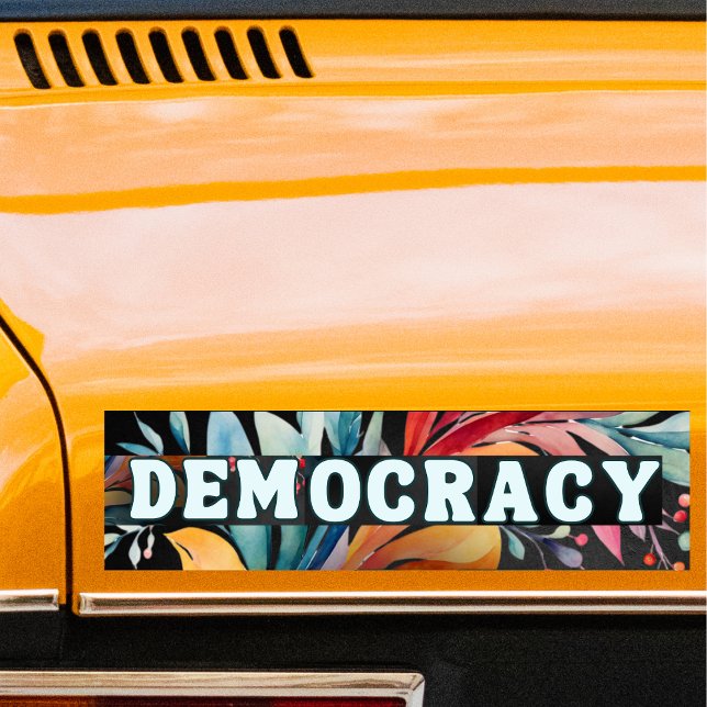Adesivo Para Carro Hippie Retro Groovy Democracy Política (A bumper sticker with the word 'Democracy' in retro groovy lettering, on a colorful background)