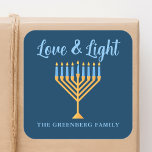 Adesivo Quadrado Amor e Azul Claro Dourado Chanucá Menorah<br><div class="desc">Um belo personagem com um adesivo de amor e Hanukkah leve para uma família judia ou uma festa Chanukah com uma sinagoga. Personalize com seu próprio sobrenome ou informações de grupo em azul sob o bonito menorá dourado.</div>