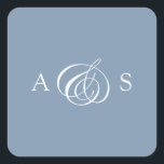 Adesivo Quadrado Casamento de Dusty Blue Monograma<br><div class="desc">Elevem a sua papelaria de casamento com o nosso Dusty Blue Monograma Wedding Square Sticker, uma mistura perfeita de elegância clássica e simplicidade moderna. Colocado sobre um fundo azul macio e empoeirado, este adesivo quadrado apresenta as iniciais do casal delicadamente entrelaçadas por um símbolo "&" escrito à mão elegante no...</div>