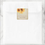 Adesivo Quadrado Cores d'água Girassóis em pergaminho desbotado<br><div class="desc">Estes adesivos românticos de casamento apresentam um design floral vintage. O fundo é um design de papel pergaminho, com aspecto rústico e esmaecido, acentuado com ouros de girassol a cores. Um delicado buquê selvagem aparece no topo à esquerda, com os nomes do casal e a data do casamento impressos abaixo....</div>