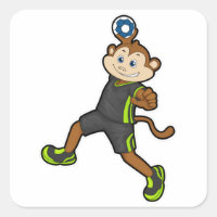 Macaco no jogador de Handball com Handball