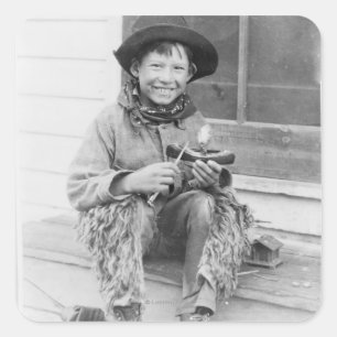 Adesivo Quadrado Menino vestido como o vaqueiro com brinquedos