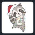 Adesivo Quadrado Raccoon Christmas Snow Winter Raccoons<br><div class="desc">O racon a suavidade com luzes de fada. Animais engraçados com presentes e neve até as férias. Também é engraçado para o Natal em julho. Os guaxinins são animais doces e perfeitos para o Natal.</div>