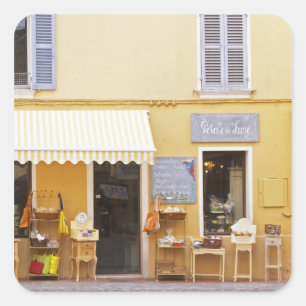 Adesivo Quadrado Uma rua de mercado na velha cidade com um compro