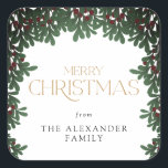 Adesivo Quadrado Winter Greenery Mistletoe Christmas<br><div class="desc">Este encantador adesivo de Natal mostra uma fronteira verde de inverno e a mensagem "Feliz Natal". O texto personalizado permite personalizar com seu nome.</div>
