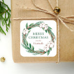 Adesivo Quadrado Winter Merry Christmas Watercolor<br><div class="desc">Este adesivo personalizado apresenta uma camada aquosa de verde e verde-marrom de inverno,  incluindo pinheiro e algodão. As palavras "Feliz Natal" aparecem na letra verde da serifa. Personalize o design com seu nome familiar em itálico marrom.</div>