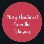 Adesivo Red Merry Christmas from Family Name Gift Label<br><div class="desc">Mantenha-o simples com este adesivo de Natal vermelho festivo. Tem a mensagem "Feliz Natal dos Johnsons" em um roteiro de tipografia na moda branca. Para personalizar, basta adicionar seu nome de família na caixa de texto personalizar esta. Você também pode mudar a mensagem de feriado ou a cor na ferramenta...</div>