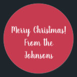 Adesivo Red Merry Christmas from Family Name Gift Label<br><div class="desc">Mantenha-o simples com este adesivo de Natal vermelho festivo. Tem a mensagem "Feliz Natal dos Johnsons" em um roteiro de tipografia na moda branca. Para personalizar, basta adicionar seu nome de família na caixa de texto personalizar esta. Você também pode mudar a mensagem de feriado ou a cor na ferramenta...</div>
