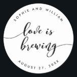 Adesivo Relax Script Love é Breing Wedding Favor<br><div class="desc">Vinheta de casamento com as palavras "O amor é a criação" numa escrita cursiva relaxada a preto contra um fundo branco. Personalize-o substituindo o texto do marcador de posição. Para obter mais opções, como alterar a fonte e seu tamanho/cor, expanda a curva/contrato ou o espaçamento entre letras, clique no botão...</div>
