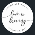 Adesivo Relax Script Love é Breing Wedding Favor<br><div class="desc">Vinheta de casamento com as palavras "O amor é a criação" numa escrita cursiva relaxada a preto contra um fundo branco. Personalize-o substituindo o texto do marcador de posição. Para obter mais opções, como alterar a fonte e seu tamanho/cor, expanda a curva/contrato ou o espaçamento entre letras, clique no botão...</div>