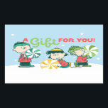 Adesivo Retangular Amendoins | Um presente para você<br><div class="desc">As designs de Natal de Charles Schulz,  que incluem os amendoins,  capturam a essência da inocência infantil e o espírito que anima a época de férias.</div>