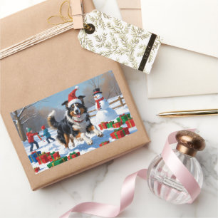 Adesivo Retangular Rough Collie correndo em neve com chapéu de Natal