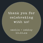 Adesivo Retro Typewriter Olive Custom Wedding Thank You<br><div class="desc">This wedding thank you sticker features an earthy olive green background with typewriter-style typography for a clean, modern look. The round format is ideal for sealing envelopes, favor bags, boxes, or wrapping paper. Names and date can be personalized to match your wedding details. A simple, timeless finishing touch for modern...</div>