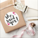 Adesivo She Said Yes! Engagement Celebration – Romantic<br><div class="desc">Celebrate one of life’s most unforgettable moments with this beautiful “She Said Yes!” text-based design. Perfect for engagement announcements, bridal celebrations, and wedding planning excitement, this romantic statement captures the joy of saying yes to forever. Ideal for T-shirts, mugs, invitations, stickers, and engagement party décor, this design makes a thoughtful...</div>