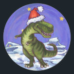 Adesivo Tyrannosaurus Christmas<br><div class="desc">O design de Natal Tyrannosaurus Rex da Parada Animal apresenta nosso lindo Tyrannosaurus Rex vestindo um chapéu vermelho de Papai Noel e colocando-se em uma paisagem nevada contra um céu noturno azul estrelado. Nossa arte original de dinossauro foi pintada pelo ilustrador de nossas crianças talentosas Traci Van Wagoner. Em muitos...</div>